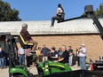 NRCS personnel trying agricultural lifts from LifeLyfts as Marty Cotterman and Steve Swain look on