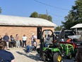 NRCS personnel looking over the lifts from LifeLyfts as Marty Cotterman speaks to them