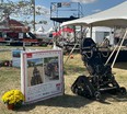 A TrackChair at the OH Farm Science Review sitting outside in the grass next to a tent