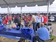 AgrAbility staff talking to visitors outside during Day At The Fair