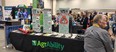 Roger Tormoehlen in front of the AgrAbility - Gearing Up booth at the FFA convention