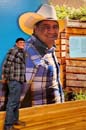 A farm apprentice standing in front of a larger-than-life display