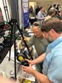Two men looking at a display at the grain conference