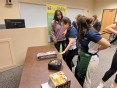 A group of female occupational therapy students at Indiana State University trying out assistive technology in a classroom