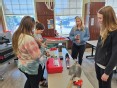 5 female occupational therapy students trying out assistive technology in a classroom at Indiana University South Bend