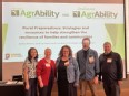 NE AgrAbility staff and Ed Sheldon standing in front of a PowerPoint slide about RURAL PREPAREDNESS