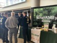John sharing with 4 male FFA members in front of a NE AgrAbility booth