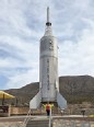 Woman standing in front of a rocket at the Space Museum in NM