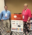 Ned Stoller and Laura Akgerman standing behind sign for Rehab Week 2025