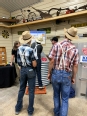 Old Order Mennonite men looking at a grain bin rescue display.