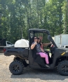 A veteran with his family in a special AT Polaris Ranger.