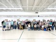Group pic of the Veterans IN Farming conference attendees in a gymnasium