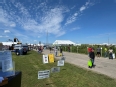 Farm Progress Show grounds with tents and signs advertising free vision screening and mental health resources
