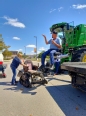 Doug Boswell demonstrating the flat-bed truck lift.