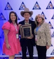 Shelby Thomas on left with a man and woman next to her during Farm Bureau award to Union County