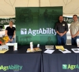 FL and GA AgrAbility staff behind the AgrAbility booth at Sunbelt Ag Expo