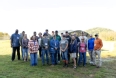 Eileen Legault - Left front - with members of the Veteran Ag Boot Camp standing in a field