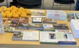 MU Extension and MO AgrAbility table displaying printed materials and some swag.