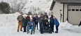 A group from the NTW out in the snow at Sleeping Bear Dunes with a Trackchair
