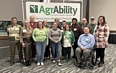OH group of 14 people at NTW with AgrAbility banner behind them