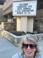 Selfie of Joetta White standing in front of the WELCOME TENNESSEE FFA 98TH ANNUAL STATE CONVENTION sign