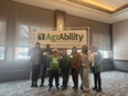 Tennessee attendees standing under an AgrAbility banner at the 2026 NTW